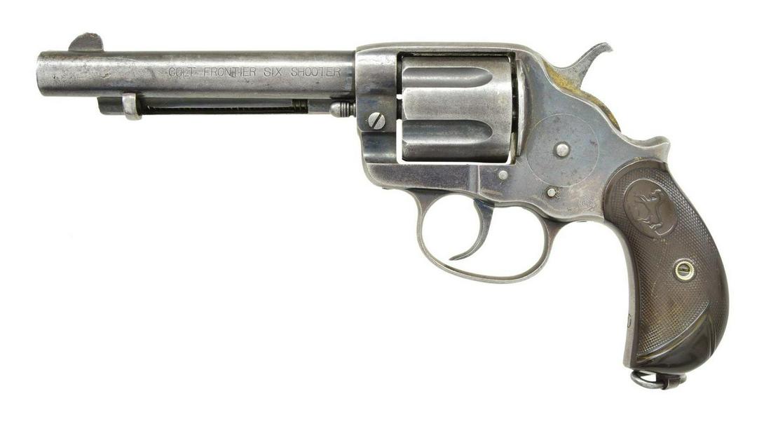 COLT 1878 FRONTIER SIX SHOOTER DA REVOLVER.: Cal. 44-40. S# 42607. Bbl. 5 1/2". Six shot long flute cyl. Blue finish w/ fire blue handling trigger. 2 Piece checkered hard rubber rampant colt grips w/ lanyard loop at butt. Mfg. 1899. CONDITION: 5