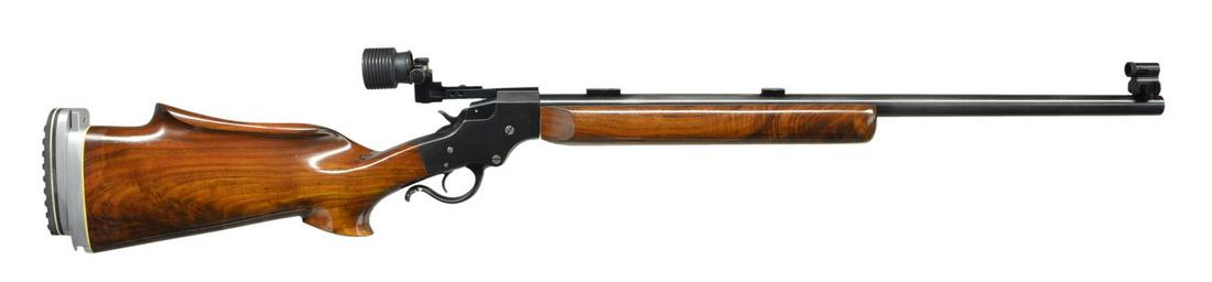 STEVENS CUSTOM MODEL 44 FALLING BLOCK RIFLE.: Cal. 22 LR. S# 81167. Bbl. 24 3/4", Model 416 fitted w/ target blocks plus Lyman #17 globe sight at front. Mfg. originally 1894-1933. Custom gunsmithed to include target forend having integral aluminu