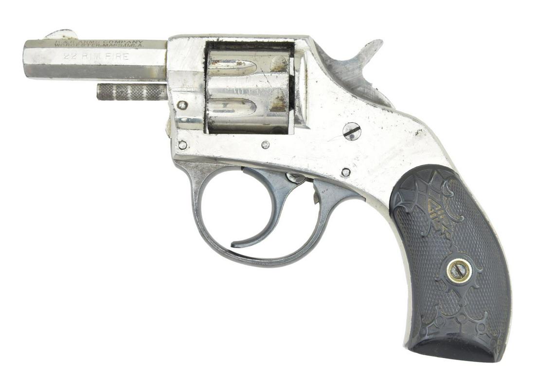 HARRINGTON & RICHARDSON YOUNG AMERICA DOUBLE: ACTION FIRST MODEL THIRD VARIATION REVOLVER. Cal. 22 RF. S# 52017 (reapplied to butt). Bbl. 2" oct. Blade front sight. 7 Shot fluted cyl. Nickel finish. 2 Piece hard rubber grips. Mfg. 1897-1904. COND