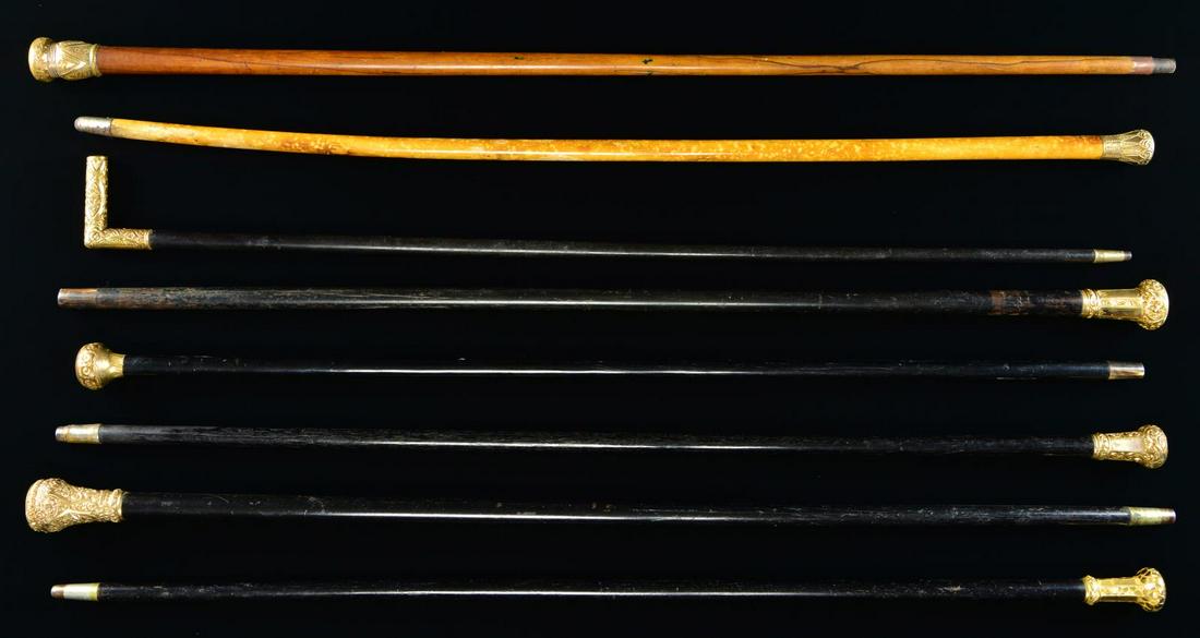 GROUP OF EIGHT VICTORIAN ERA STYLE GOLD TOP CANES: AND WALKING STICKS. All but 2 cane tops here have no inscription or initials, all unique repoussé gold filled heads, 35"-37" lengths. (02-19290-2/JS). $200-400.