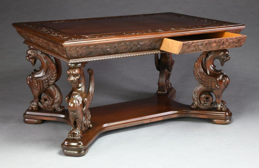 EXCEPTIONAL CARVED WINGED GRIFFIN LIBRARY TABLE. (1 of 4)