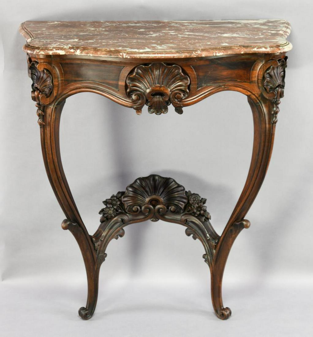 EXCEPTIONAL ROCOCO ROSEWOOD CONSOLE WITH MARBLE: TOP. Probably Philadelphia. Early 3rd quarter, 19th century. This lovely well carved console retains its original Breschia marble top with serpentine and molded edges above the conforming molded friez