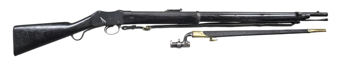 NEPALESE ENFIELD 1875 DATED MARTINI HENRY: SHORT LEVER SINGLE SHOT RIFLE WITH BAYONET. Cal. .577/450 Martini-Henry. S# NSN. Bbl 33-3/8". Gray patina with solid wood buttstock and forend. "N.S./ N.E.P." indicating "Native Service Nepal" on left
