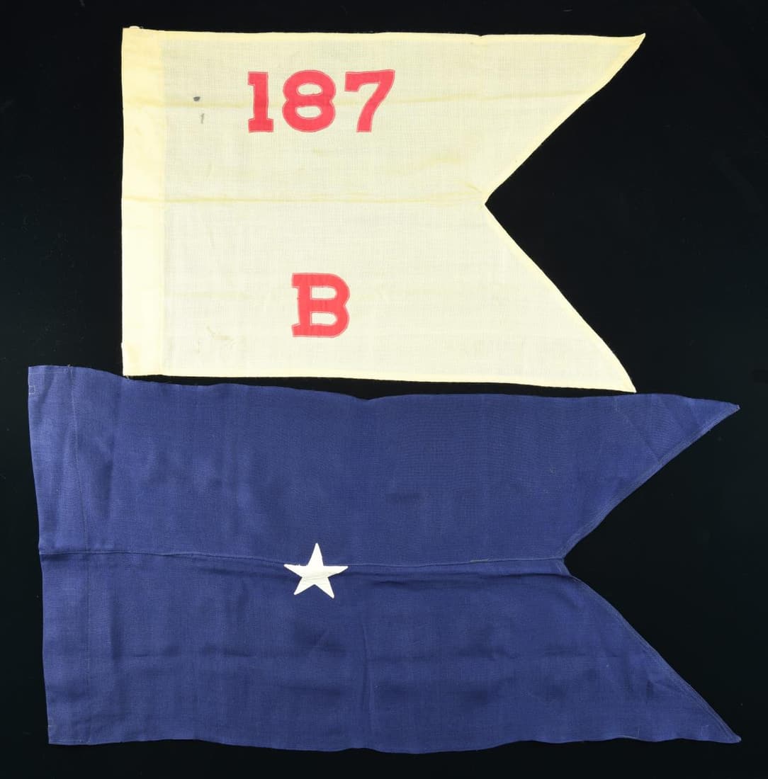 TWO MILITARY FIELD GUIDONS.: 1) 22x38" [Air Force] general's field guidon. 2) 19x29" 187th Supply Command guidon. CONDITION: very good overall. (02-19473-64/JS). $100-200.