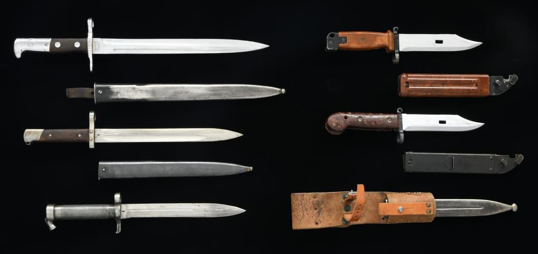 5 EUROPEAN BAYONETS.: 1) AKM TYPE I BAYONET WITH SCABBARD. CONDITION: very good w/ light marks. 2) RUSSIAN AKM TYPE II WITH SCABBARD. CONDITION: good. 3) AUSTRIAN STEYR MODEL 95 BAYONET WITH SCABBARD. S# 6570. CONDITION: v