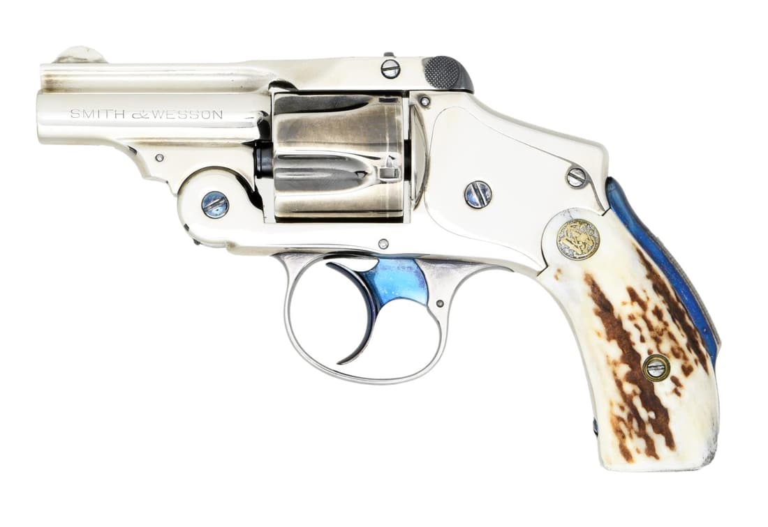 VERY SCARCE 5th MODEL BICYCLE GUN SMITH &: WESSON LEMON SQUEEZER. Cal.38 S&W. S# 255817. Bbl. 2". Mfg. 1907-1940. 38 S&W top break, double action Bicycle revolver w/ backstrap safety. 5 shot fluted cylinder. Stag grips w/ gold colored S&W meda