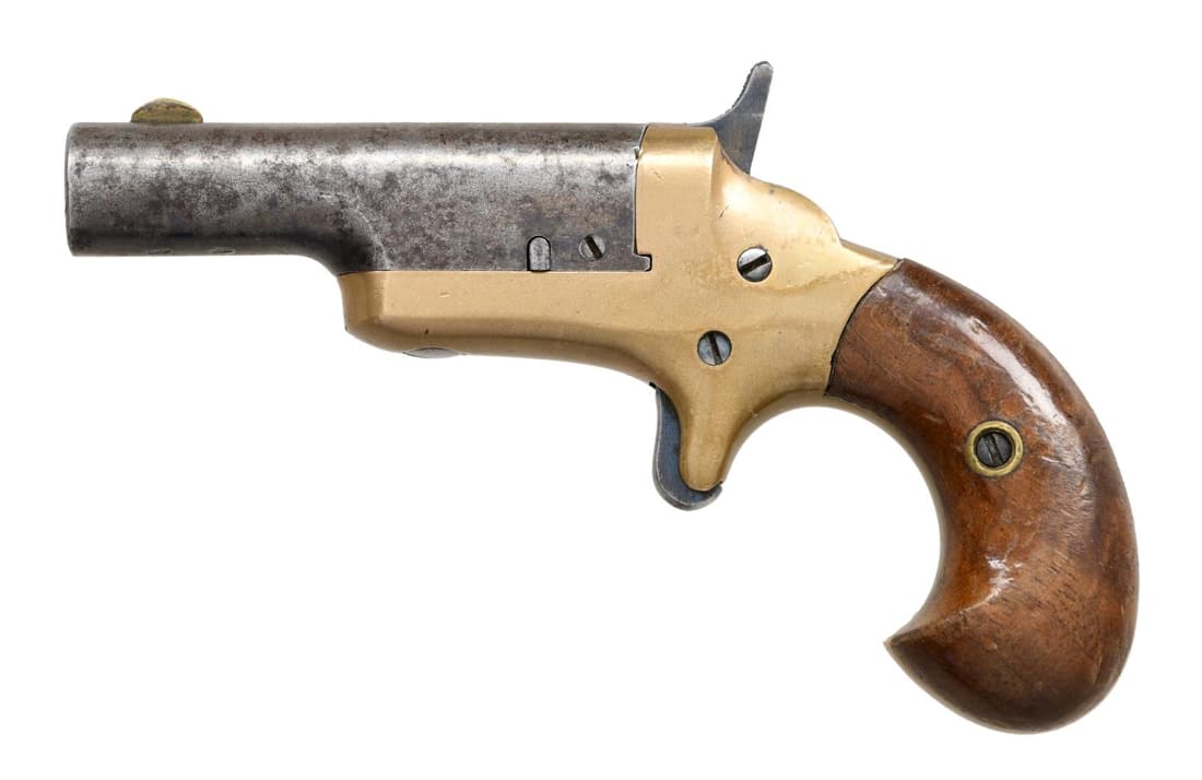 BRITISH PROOFED COLT THUER DERRINGER.: Cal. .41 RF. S# 12201. Bbl 2 1/2". Brass frame w/ case color hardened trigger and hammer. Iron bbl w/ brass half-moon front sight. 2 piece smooth wood birds head grips. Bbl marked "-COLT-" across the 