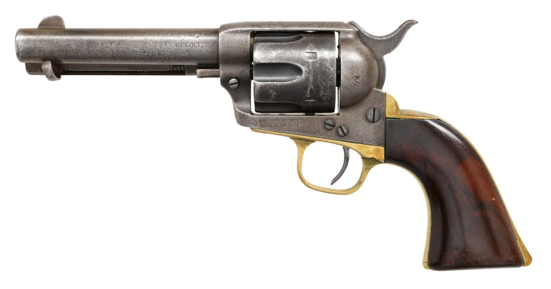 COLT SAA REVOLVER.: Cal. 45 Colt. S# 186794. Bbl. 4 3/4". Replacement unnumbered brass straps, Cyl. pin, and grips. CONDITION: Void of metal finish with an even grey patina. Refinished undersized grips with added varnish