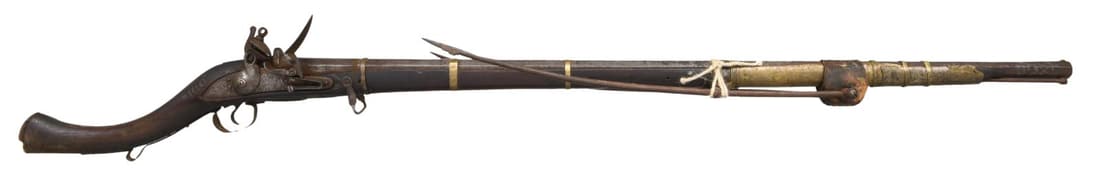 EARLY 19th CENTURY MIDDLE EASTERN CAMEL GUN &: BIPOD. Cal. 60. NSN. Bbl. 41 1/2". Octagon barrel flared at the muzzle with a small copper blade sight. 8 Small brass bands attach the barrel to the stock. The touch hole appears to possibly be re-bus