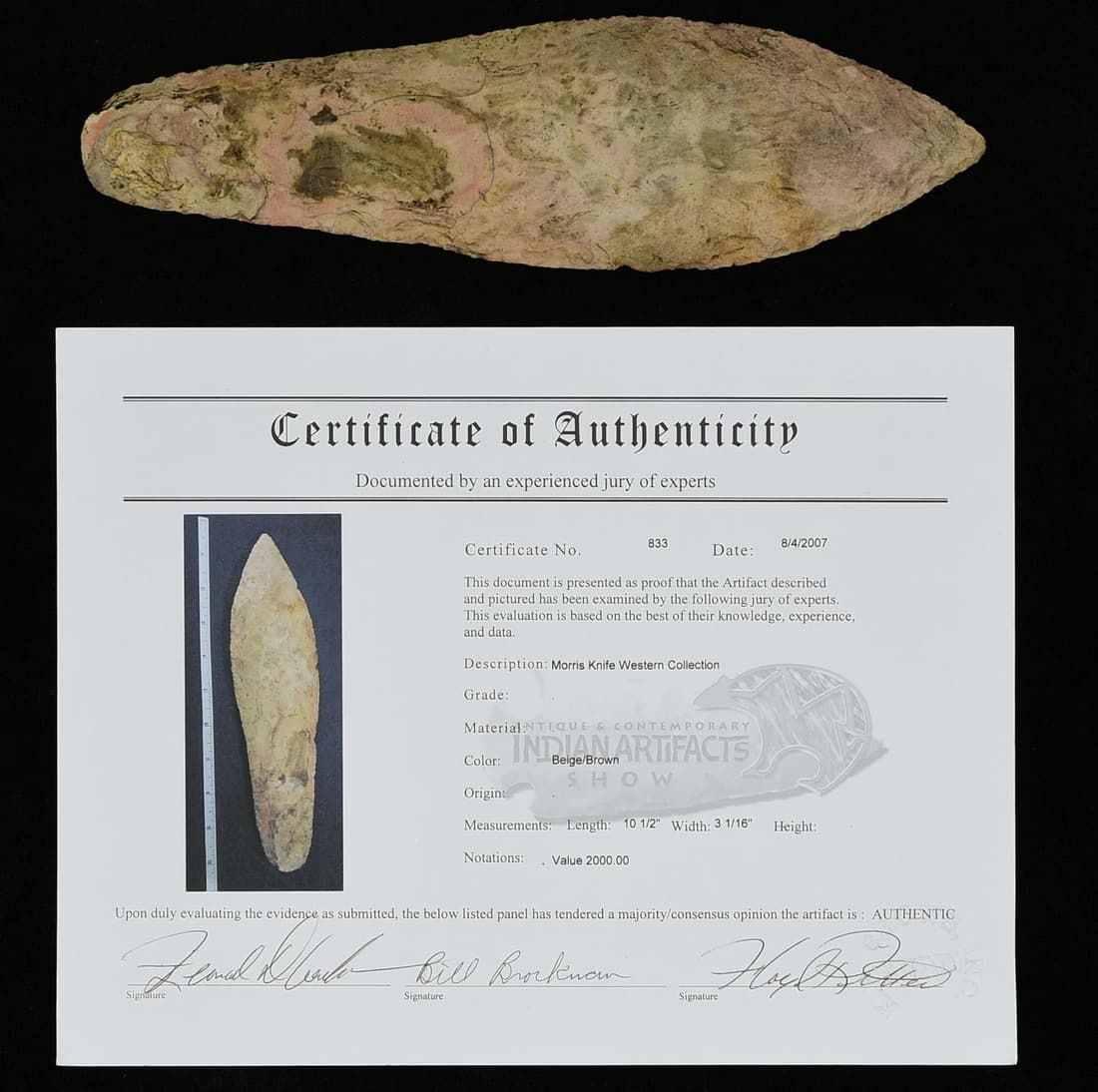 FINE LARGE EXCAVATED INDIAN STONE KNIFE.: Accompanied by COA signed by 3 experts at 2007 Midwest artifact show including the late Floyd Ritter & Bill Brockman, both well known collector/dealers. Knife measures 10.5" long, widest 3.1", found i