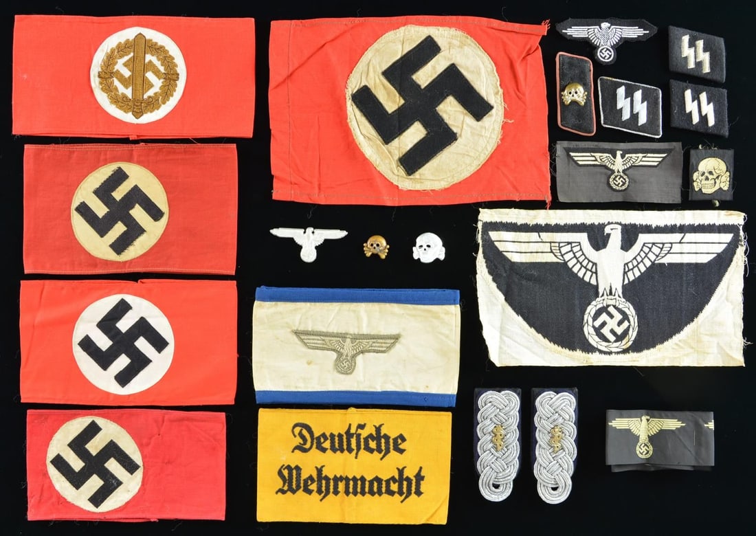 WWII GERMAN MEMORABILIA FLAGS AND ARMBANDS.: This varied lot of WWII German pieces includes 1 Kreigsmarine battle flag measuring approx. 100" x 58" captured by Corporal Donald W. Dunlope of the 3rd Army. Corporal Dunlope recorded the towns that 