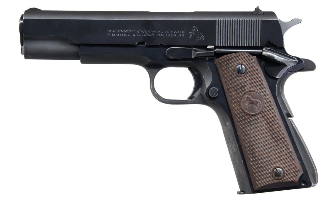 COLT MODEL 1911 GOVERNMENT MODEL SEMI-AUTOMATIC: PISTOL. Cal. 45 ACP. S# 291510-C. Bbl 5". Model 1911 Government Model manufactured by Colt in 1963. The left side fo the slide bears markings stipulating the model and caliber designations, followed b