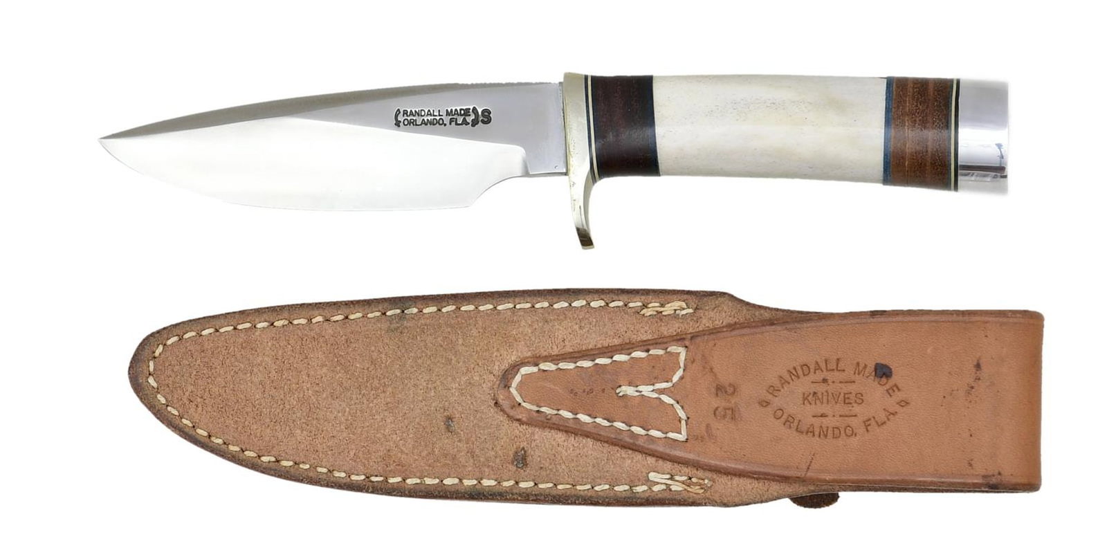 RANDALL MODEL 25 TRAPPER KNIFE.: Overall length 9 1/2" w/ 5" blade. Blade marked "RANDALL MADE ORLANDO, FLA S". Top of blade has thumb notches. Nickel silver single hilt. Ivorite leather grip. Duraluminum butt cap. UNATTACHED ACCESSO