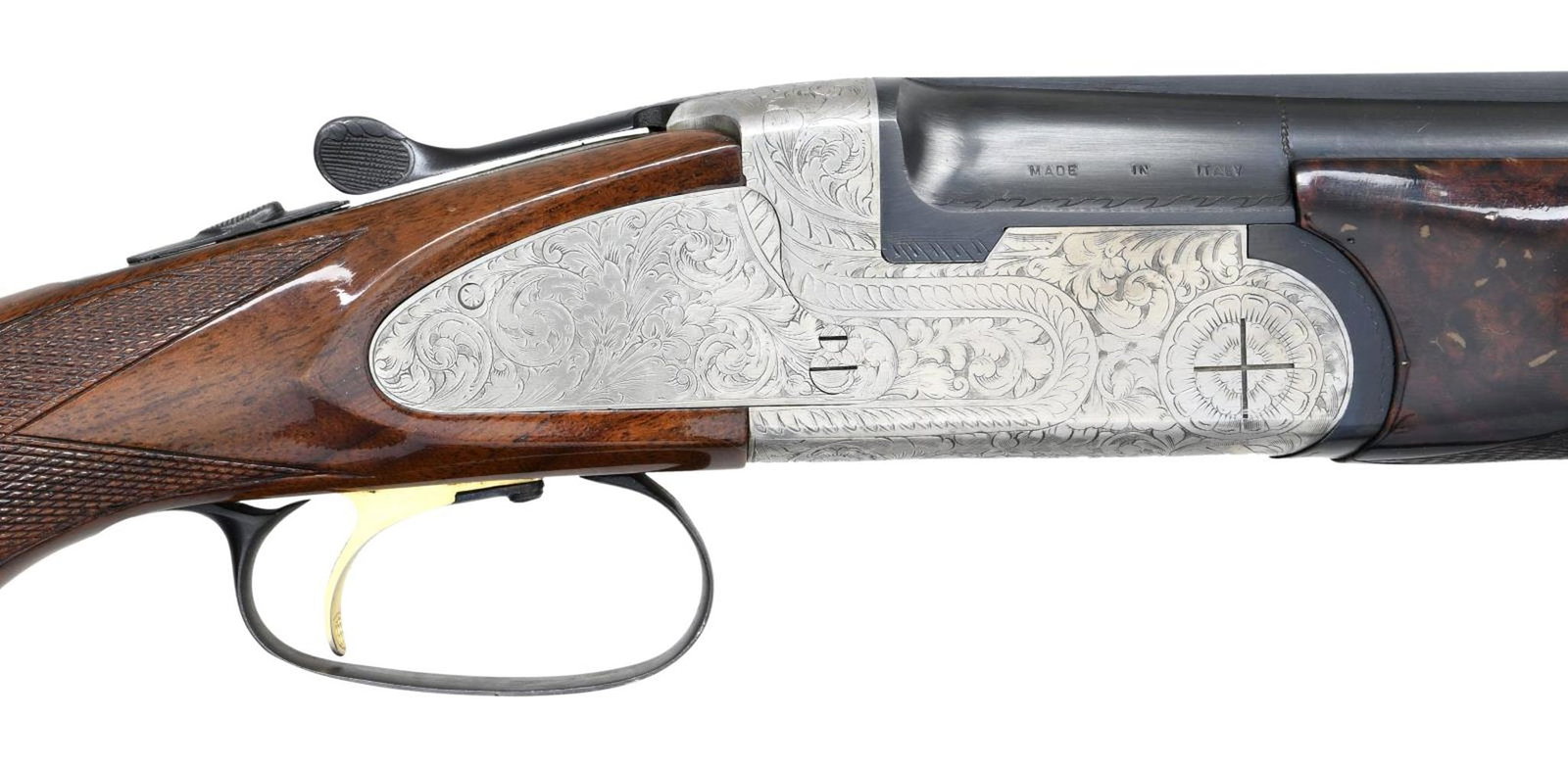 WEATHERBY REGENCY O/U SHOTGUN.: Cal. 20 Ga 3". S# R06221. Bbls. 26" VR choked cyl. Gold bead front sight. Brightly finished action w/ floral engraving. Gold forend latch & single trigger. Blued bbls., trigger guard, safety & action 