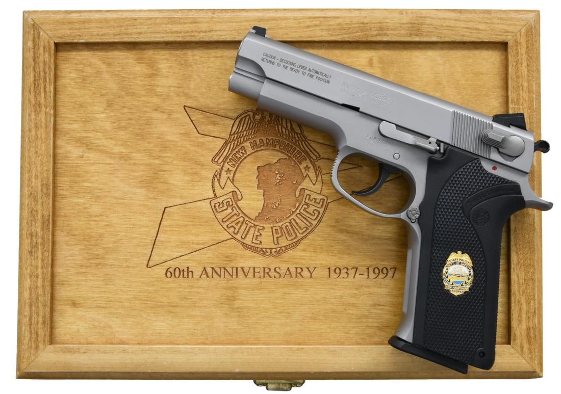 SMITH & WESSON MODEL 4566 NEW HAMPSHIRE STATE: POLICE 60TH ANNIVERSARY COMMEMORATIVE PISTOL. Cal. 45ACP. S# VJP5741. Bbl.4.25". Mfg. 1997. Satin stainless frame & slide. Serrated slide w/ dovetailed 3 dot sights. Ambidextrous decocker. Black plast