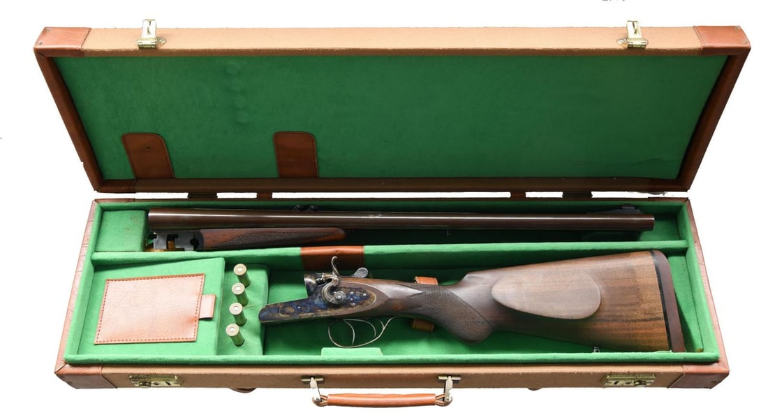 TRAIL GUNS ARMORY / PEDERSOLI KODIAK MK IV DOUBLE: RIFLE. Cal. 45-70. S# C5494 (AU = 1989). Brown finished 24" bbls. w/ ramp mounted bead front sight & 2 flip up rear sights. Case colored sidelock hammer action w/ rebounding hammers, dbl. triggers & e