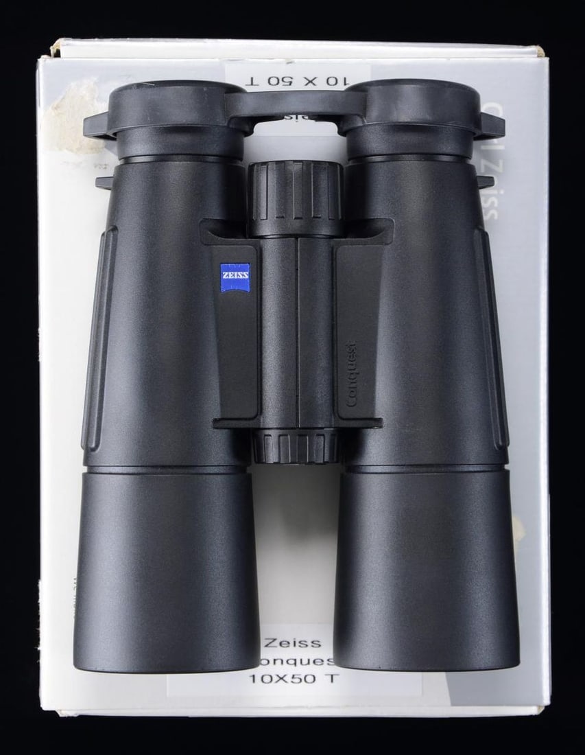ZEISS CONQUEST 10X50 BINOCULARS.: Mfg in Hungary by Zeiss. Matte black finish. 10x power. UNATTACHED ACCESSORIES: factory box w/ black pouch, lens covers, manual & carrying strap. CONDITION: all aspects near excellent. PROVENANCE: The