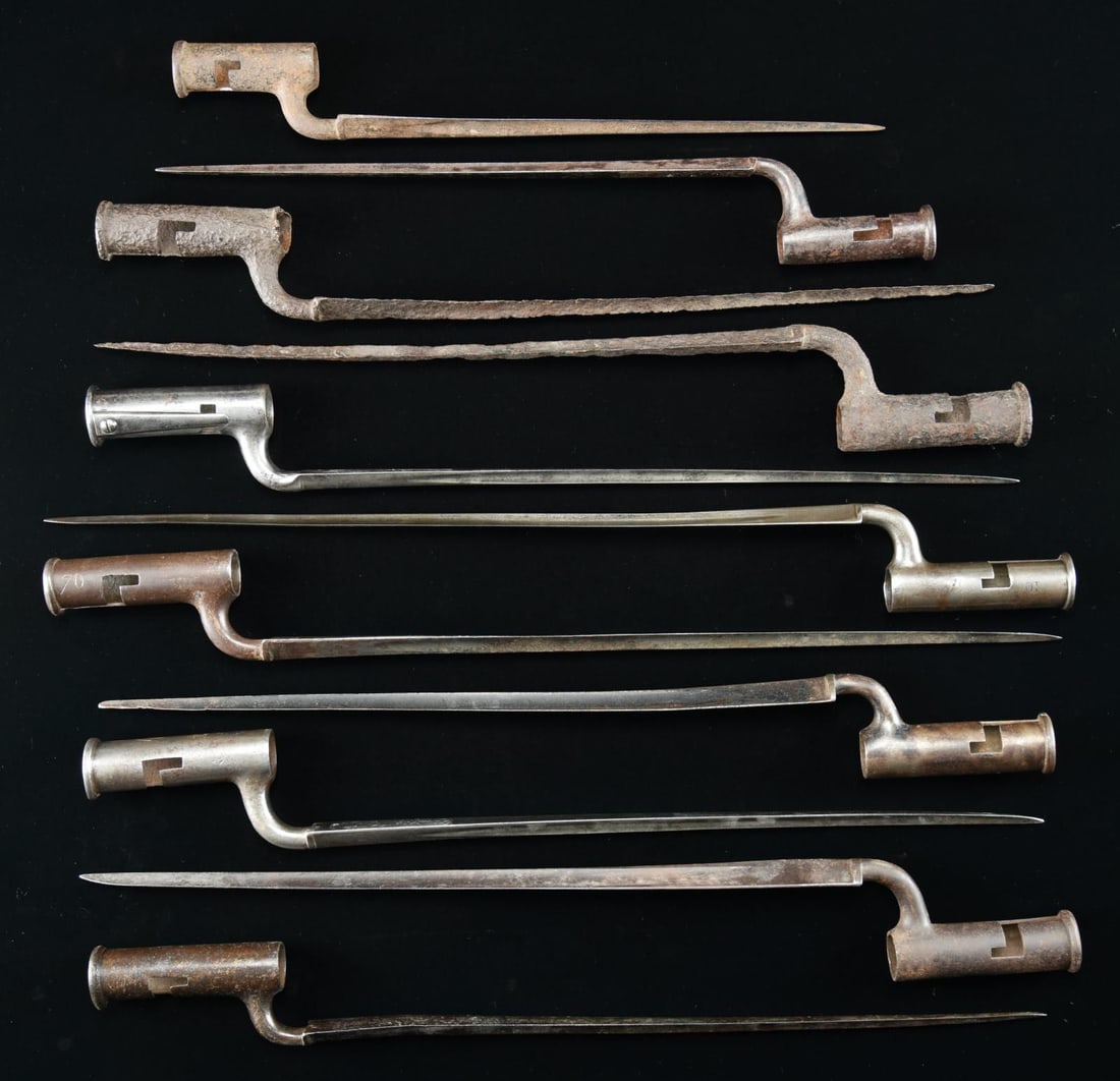11 BRITISH SOCKET BAYONETS.: 1) A British land pattern bayonet measuring 20 3/4" overall with a 4” socket and a 16” blade. The blade has a raised medial ridge on the base with back flutes. The flat of the blade is sta