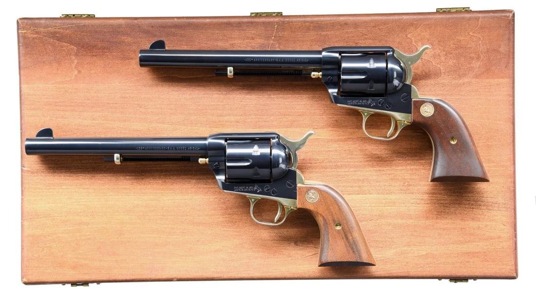 CASED CONSECUTIVE PAIR of COLT 125th ANNIVERSARY: SAA REVOLVERS DOCUMENTED TO AUDIE MURPHY. BOTH: Cals. 45 Colt. Bbls. 7 1/2" with Colt blades (frame notched rears) plus "-125th ANNIVERSARY-S.A.A. MODEL .45 CAL.-" on left sides. Produced 1961 (first