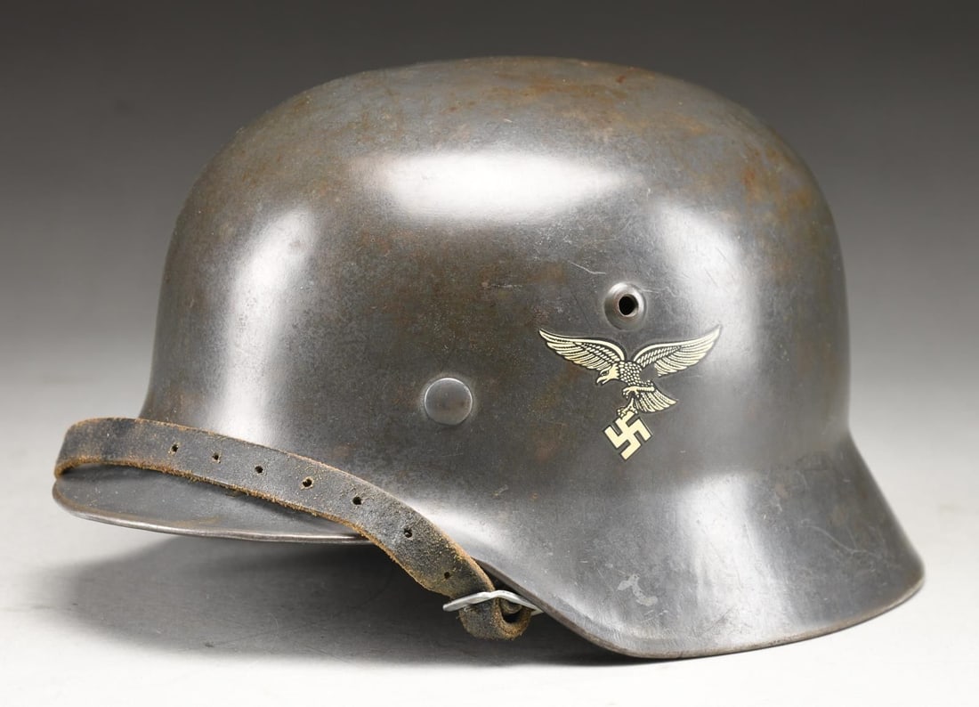 EARLY PRE-WAR GERMAN LUFTWAFFE DOUBLE DECAL M1935: HELMET. This helmet has a dark blue-gray original finish with original decals and completely original liner & chinstrap. It is so difficult to find an early helmet that has not been altered in some wa