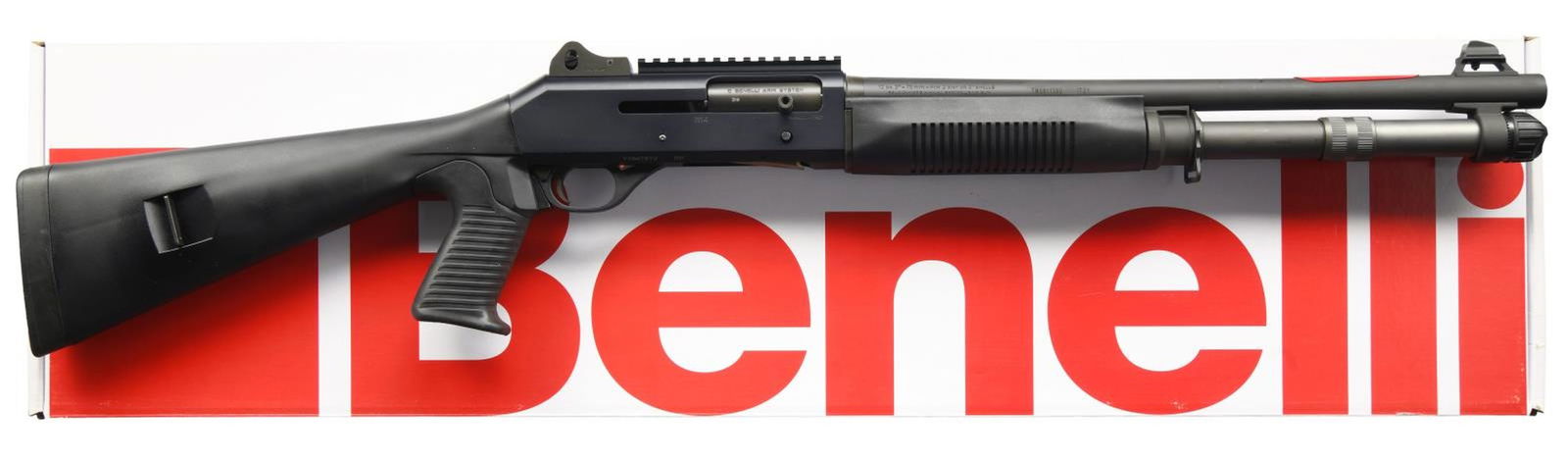 BENELLI M4 TACTICAL SEMI-AUTOMATIC SHOTGUN WITH: MATCHING FACTORY BOX. Cal. 12 GA, 2 3/4" or 3". S# Y164781V. Bbl 18 1/2". M4 Tactical semi-automatic shotgun mfg. by Benelli in Italy and imported by Benelli U.S.A. The left side oft he bbl. is marked