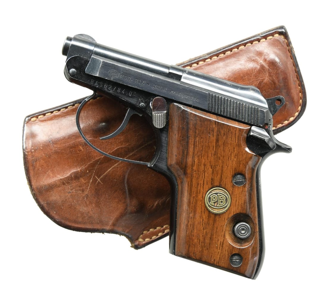 BERETTA 21A SEMI AUTO PISTOL.: Cal. 22 LR. S# BAS02784U. Bbl. 2 1/2". Round blade front sight. Fixed rear sight. Blue & anodized finishes. Smooth hardwood grips w/ PB logo. MAGS: none present. UNATTACHED ACCESSORIES: right hand Saf
