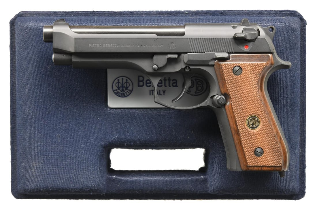 BERETTA 92F SEMI AUTO PISTOL.: Cal. 9mm Luger. S# B94472Z. Bbl. 5". White dot front sight. White outline rear sight. Parkerized finish. Ambi safety that also acts as a decocker. Checkered hardwood grips w/ PB logo. MAGS: none prese