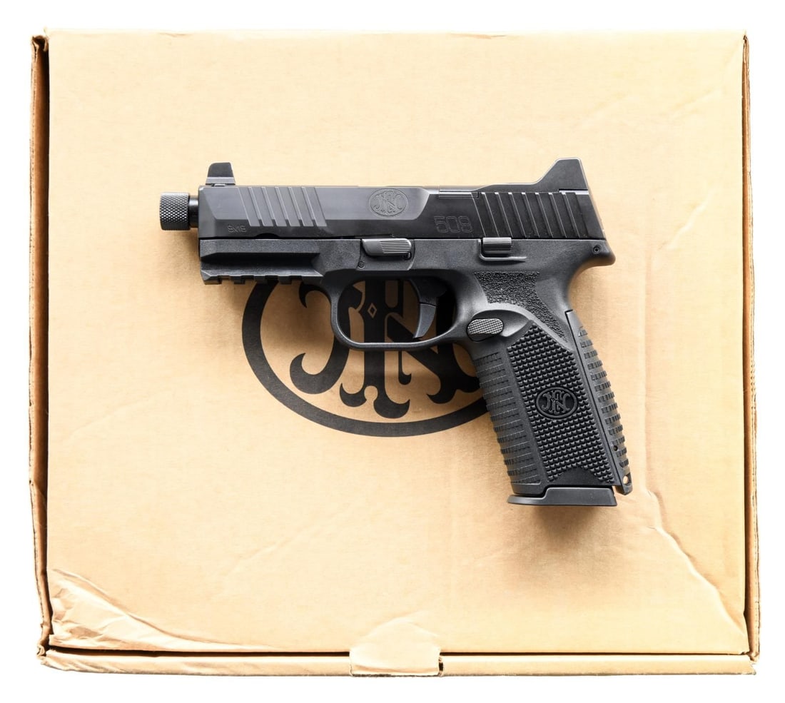FN 509 TACTICAL SEMI AUTO PISTOL.: Cal. 9mm. S# GKS0231964. Bbl. 4 1/2" threaded w/ thread protector. Three dot night sights. Slide is factory cut for RMR plate for red dot sight mounting. Ambi slide & mag release. Matte black finish. 