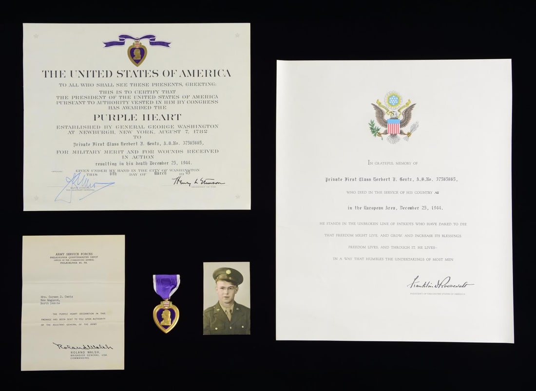 WWII US KIA GROUP BELONGING TO PFC HERBERT GENTZ.: This group includes a named Purple Heart belonging to PFC Gentz, and the award document for this medal dated March 6, 1945. There is also a short note from Brigadier General Walsh to Mrs. Gentz. Also 