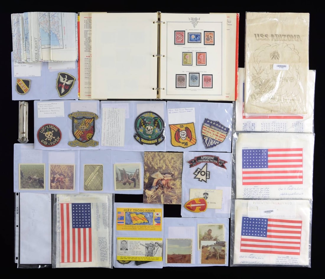 US, JAPANESE, GERMAN, & VIETNAMESE MILITARIA.: This varied lot includes 2 small ziplock bags containing North Vietnamese Military medals & small badges. / 2 Shipboard newspapers from the USS Arizona dated in the mid-1930s. / 1 Vietnamese stamp alb