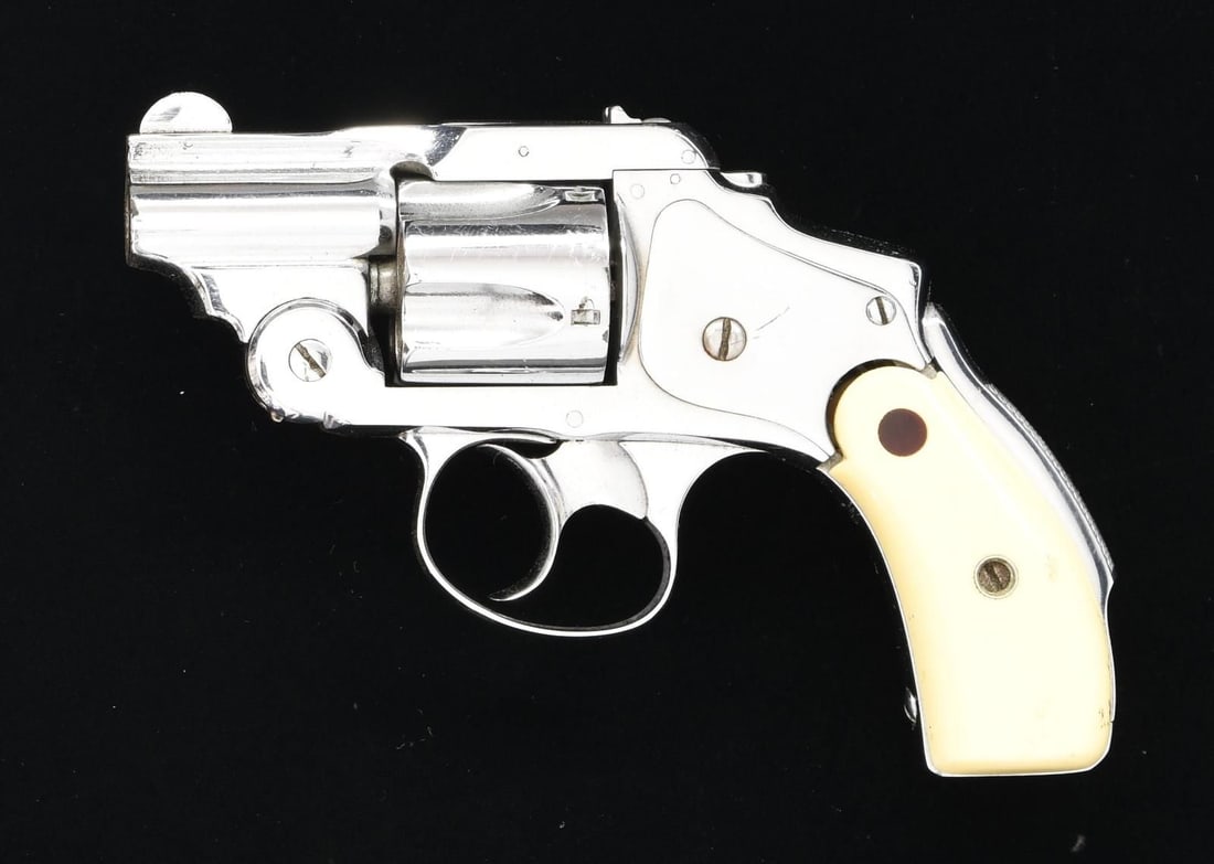 S&W SAFTEY HAMMERLESS REVOLVER.: Cal. 32 S&W. S# 28314. Bbl. 1 1/2" shortened. Round blade front sight. U-notch rear sight. Matching number on cyl. Bbl. patent markings are obscured due to front sight placement. Nickel finish. Ivory 