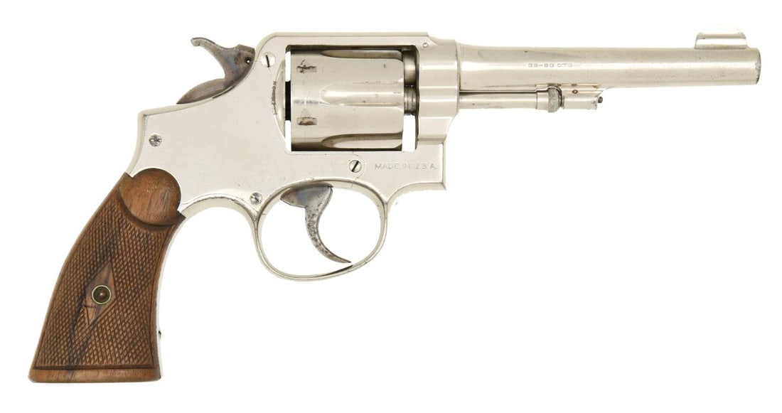 SMITH & WESSON MODEL 1905 DA REVOLVER.: Cal. 32-20. S# 115760. Bbl. 5" pinned. Round blade front sight. Fixed rear sight. Fourth change 1905 model mfg. 1915-1940. Nickel finish. Case colored trigger & hammer. Matching numbers on bbl., cyl.