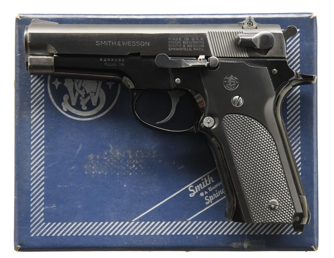 SMITH & WESSON MODEL 59 SEMI AUTO PISTOL.: Cal. 9mm Luger. S# A393592. Bbl. 4". Serrated ramp blade front sight. Square notch rear sight. Blue finish slide. Anodized frame. Black checkered grips w/ S&W logo. MAGS: 1-14 rd. UNATTACHED ACCESSORI