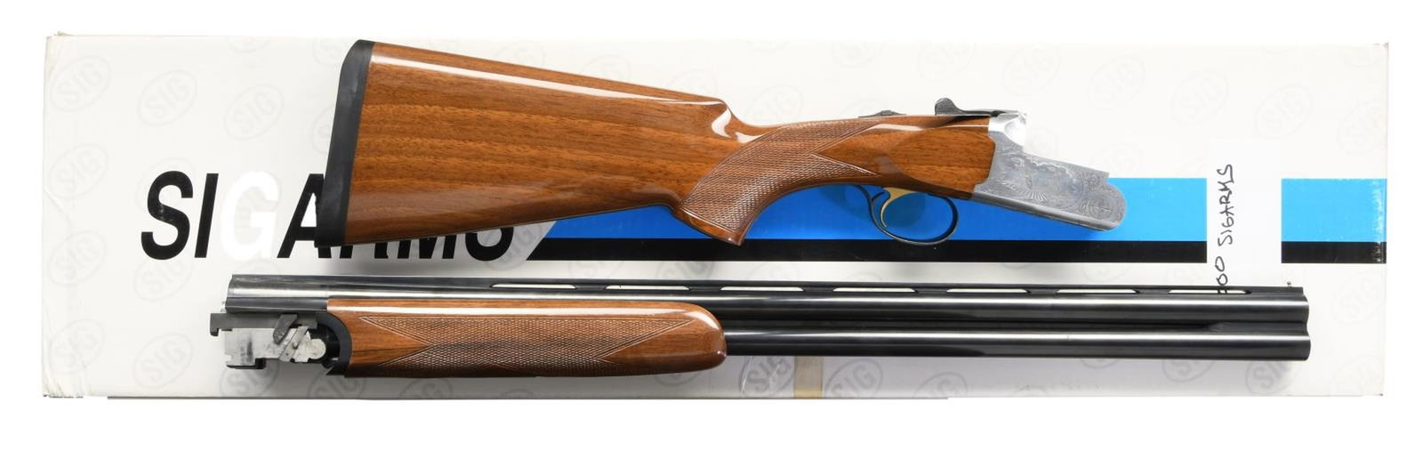 SIG ARMS SA3 O/U SHOTGUN.: Cal. 12 Ga. 3". S# AZ01616. Bbls. 28 VR choked IM & M. Italian made shotgun imported by Sig. Brass bead front sight. Brightly finished receiver w/ laser engraved bird scenes. Blued bbls. Gold single t