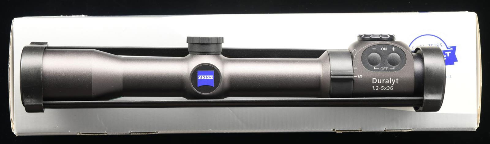 ZEISS DURALYT 1.2-5X36MM RIFLE SCOPE.: 1.2-5X36MM. Duralyt scope. Plex-style illuminated reticle. Matte finish 30mm tube. Finger tip adjustments w/ protective caps. European style fast focus. UNATTACHED ACCESSORIES: matching box w/ manuals