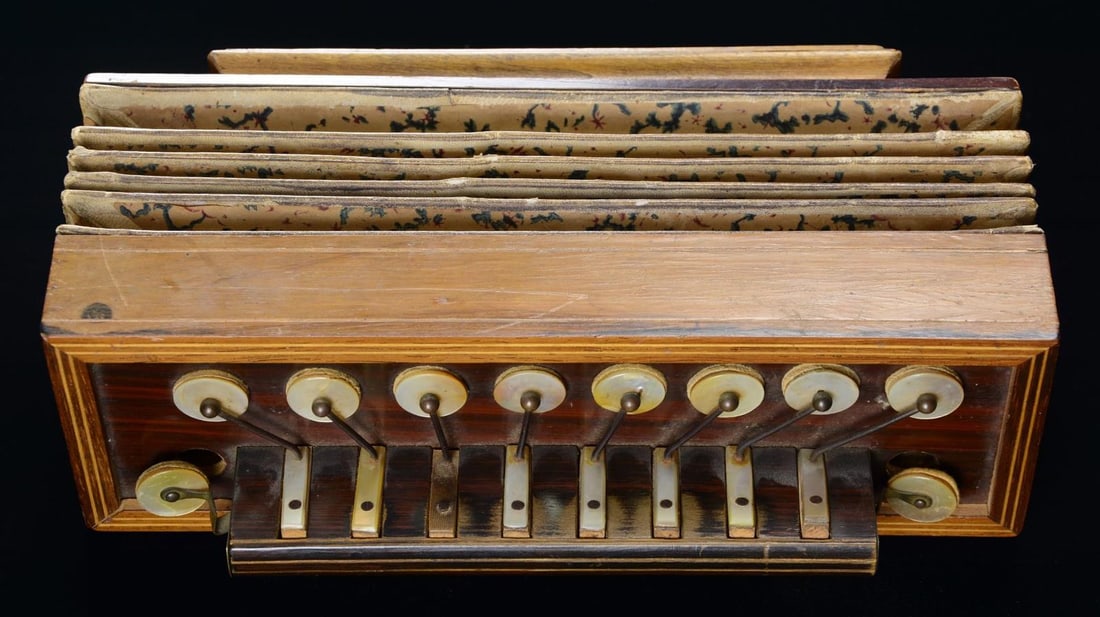 CIVIL WAR ERA CONCERTINA.: These little mother-of-pearl keyed reeded "squeezeboxes" were popular Civil War camp instruments based on pieces excavated in campsites. Made with fancy grained woods, brass & iron mounted keys. Still