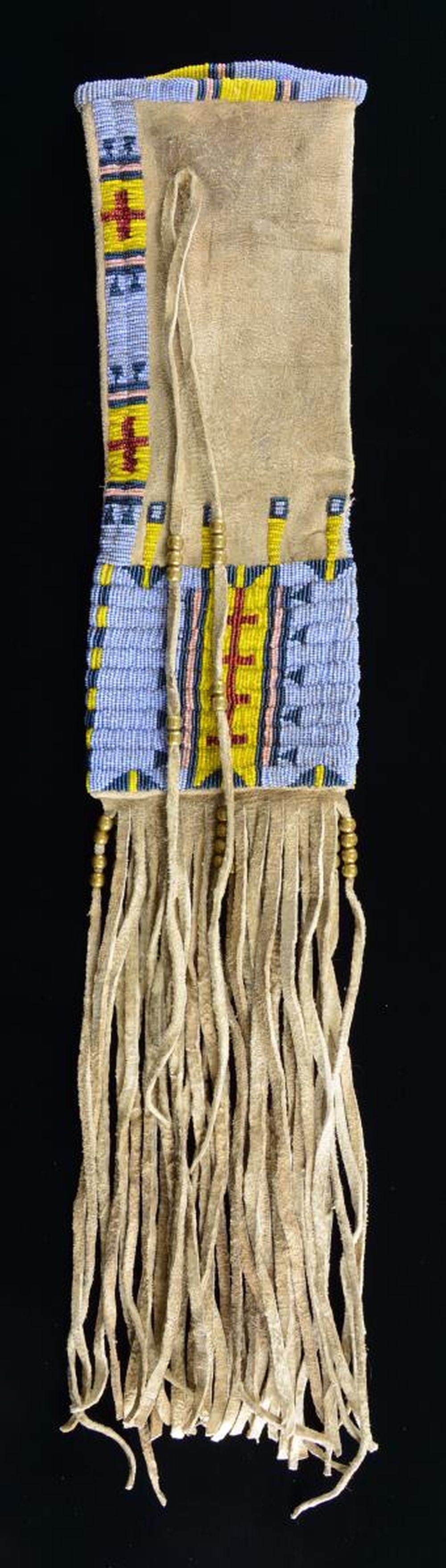 FINE DECORATIVE AMERICAN INDIAN PIPE BAG.: 27" including fringe x 5.25", thread sewn beaded throat & 4" x 5.25" panel beaded with sky blue mixed with gray ground, yellow, pink, and red, large brass beads on rawhide fringe. CONDITION: very good