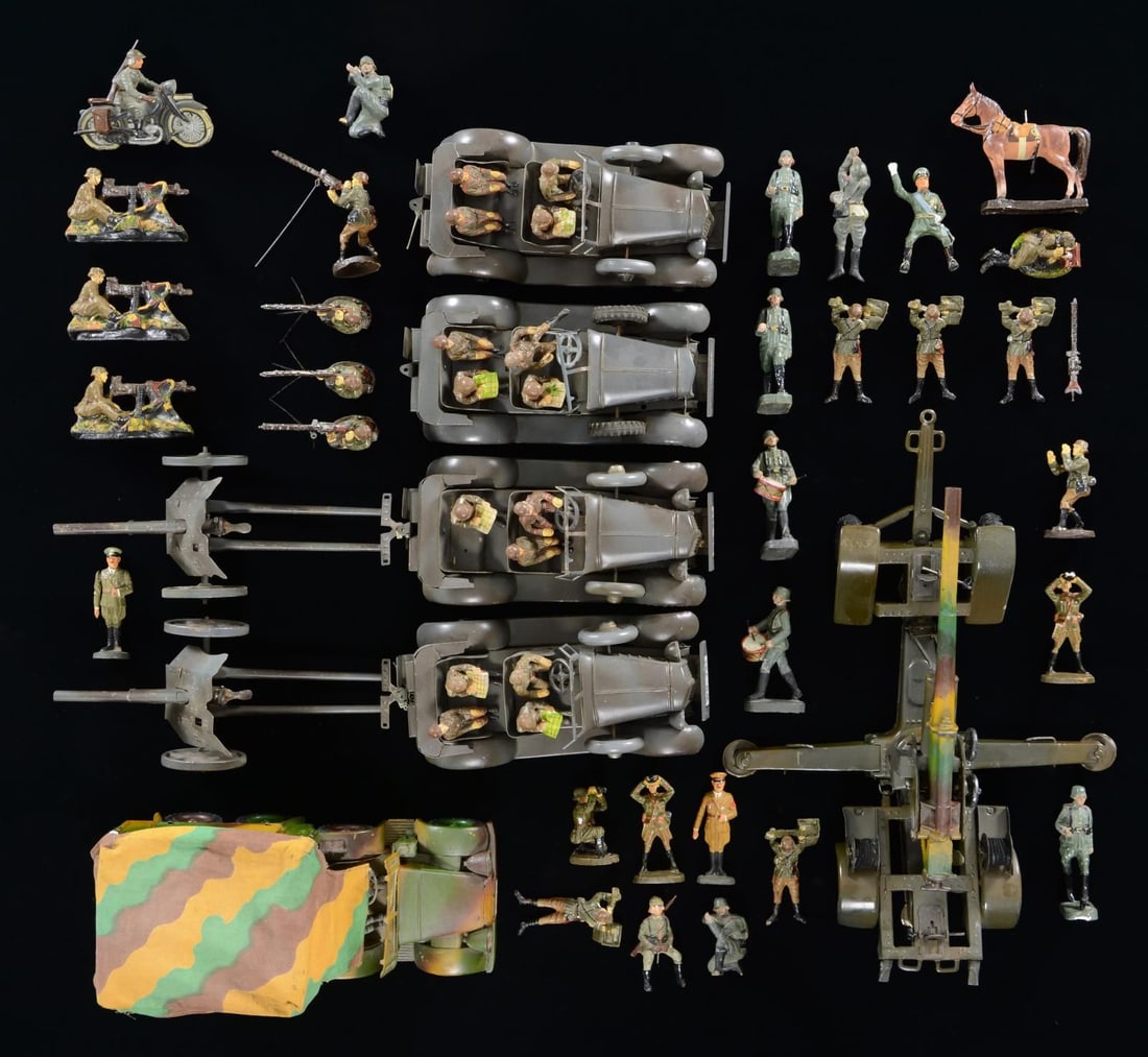 GROUPING OF GERMAN WWII MILITARY TOYS & FIGURINES.: Grouping of assorted German World War II metal toys & figures including: two 3.7 cm Pak field cannons, one 8.8 cm Flak cannon, four 4-seater cars (1 missing, 1 occupant), one personnel carrier truck, 