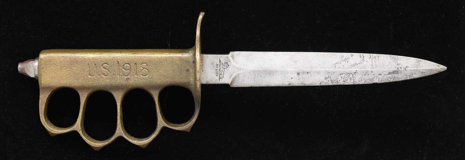SCARCE WWI AU LION 1918 TRENCH: KNIFE. French Knife made by Au Lion. Approx. 11 3/4" overall. Dbl. edged 6 3/4" blade marked w/ lion trademark & "AU LION". Brass handle marked "U.S. 1918". Hexagonal flat point skull crusher nut at p