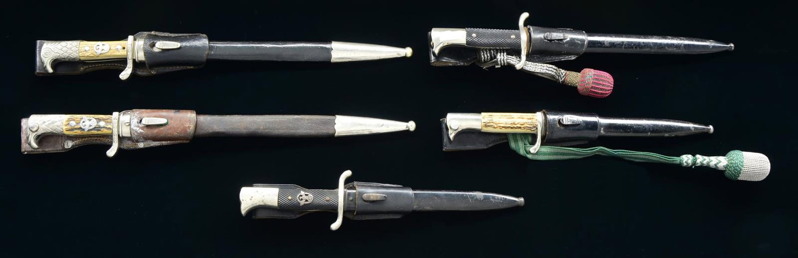 5 WWII GERMAN DRESS BAYONETS.: 1) POLICE. Overall length 18 1/8". Blade is marked “A C (scale) S” on one side and “ALEXANDER COPPEL (logo) SOLINGEN” on the other. The plated cross guard is embellished with oak leave