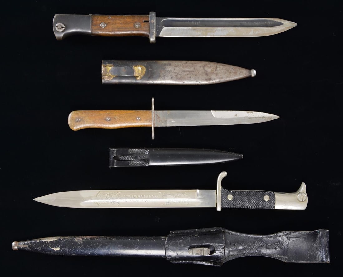 3 WWII GERMAN EDGED WEAPONS.: 1) ENGRAVED BAYONET. Bayonet measures 16 3/4" overall with a 9 5/8” blade. The blade has a single medium fuller, and is etched on one side with foliate & aeronautical motifs, along with a panel 