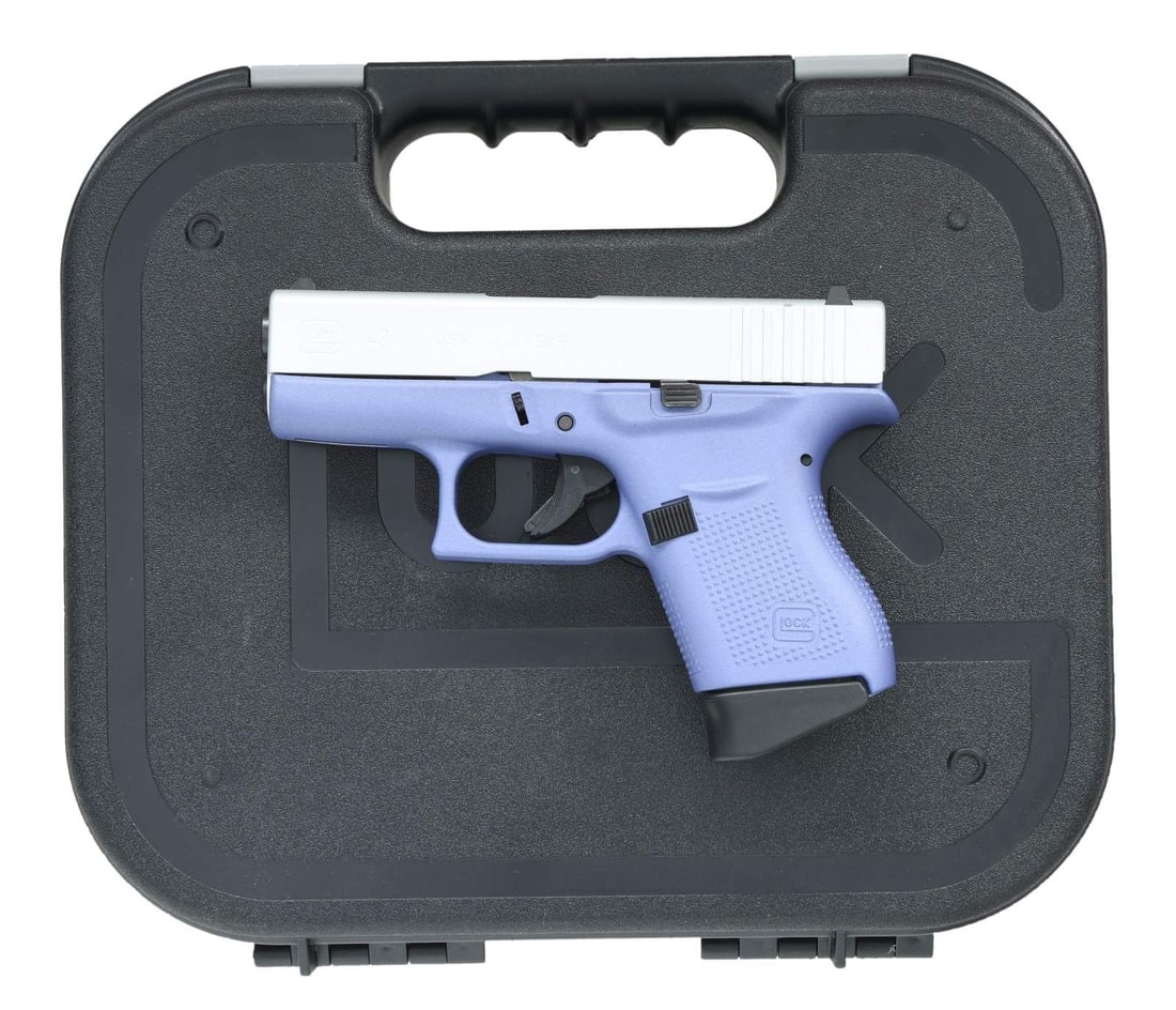 GLOCK 43 SEMI AUTO PISTOL.: Cal. 9x19. S# AGLB978. Bbl. 3 1/2". Standard white outline Glock sights. USA made Glock 43, professionally refinished by Apollo Custom Inc. Silver finished slide. Orchid finished polymer frame. MAGS: