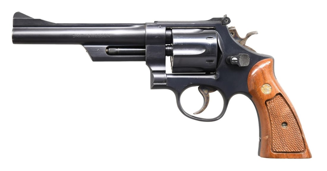 SMITH & WESSON 28-2 HWY PATROLMAN DA REVOLVER.: Cal. 357 Mag. S# N276396. Bbl. 6" pinned w/ half length underlug. Ramped serrated blade front sight. Adjustable rear sight. Mfg. 1974-77. Blue finish w/ case colored trigger & hammer. Checkered walnut