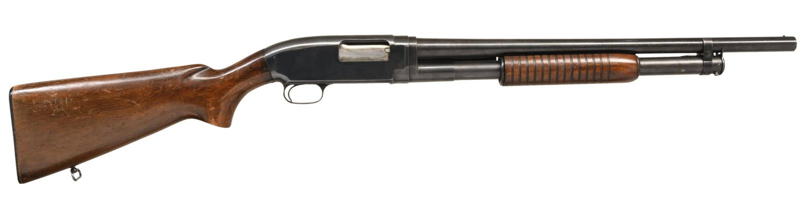 WINCHESTER MODEL 12 RIOT PUMP ACTION SHOTGUN.: Cal. 12 GA, 2 3/4". S# 1330613. Bbl. 20 3/4". Model 12 pump action shotgun in riot configuration mfg. by Winchester in 1953. The left side of the bbl. is marked with Winchester's mfg. information, fol
