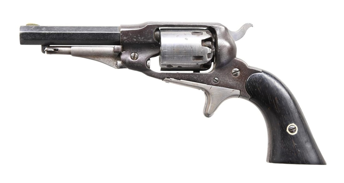 REMINGTON NM POCKET REVOLVER.: Cal. 31. S# 2306. Round blade front sight. Fixed rear sight. Blued frame & bbl. Brightly finished cyl. & spur trigger. Action functions well when hand cycled. Smooth hardwood grips. CONDITION: grips s