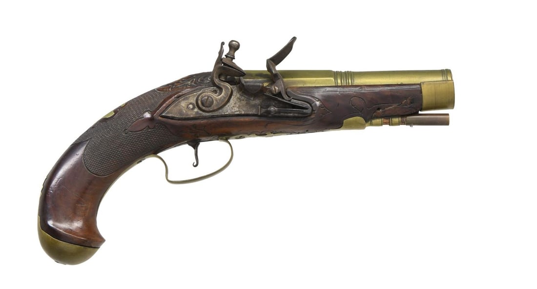 GOOD BRASS BARRELED FLINTLOCK GREAT COAT PISTOL.: Cal. 50. S# NSN. The 6-1/8" octagon to round barrel has nicely turned transition and slightly flared muzzle. Flint lock with bevelled and arched plate is fitted with high breasted serpentine cock, ins