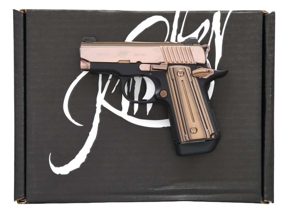 KIMBER MICRO 380 ROSE GOLD SEMI AUTO PISTOL.: Cal. 380 ACP. S# T0054662. Bbl. 2 3/4". Three dot night sights. Rose gold finished slide w/ floral accents. Ambi safety. Matte black aluminum frame. G10 grips. MAGS: 1-7 rd. factory. UNATTACHED ACCESS