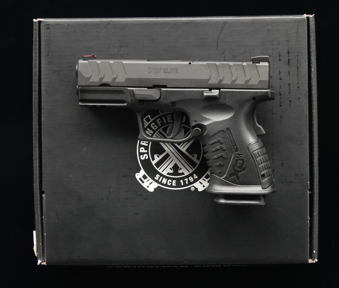 SPRINGFIELD ARMORY XDM ELITE 3.8 SEMI AUTO PISTOL.: Cal. 10mm. S# BA535734. Bbl. 3 3/4". Fiber optic front sight. White outline U-notch rear sight. Slide has factory cut for RMR plate for reflex sight mounting. Matte black finish. Polymer frame w/ acce