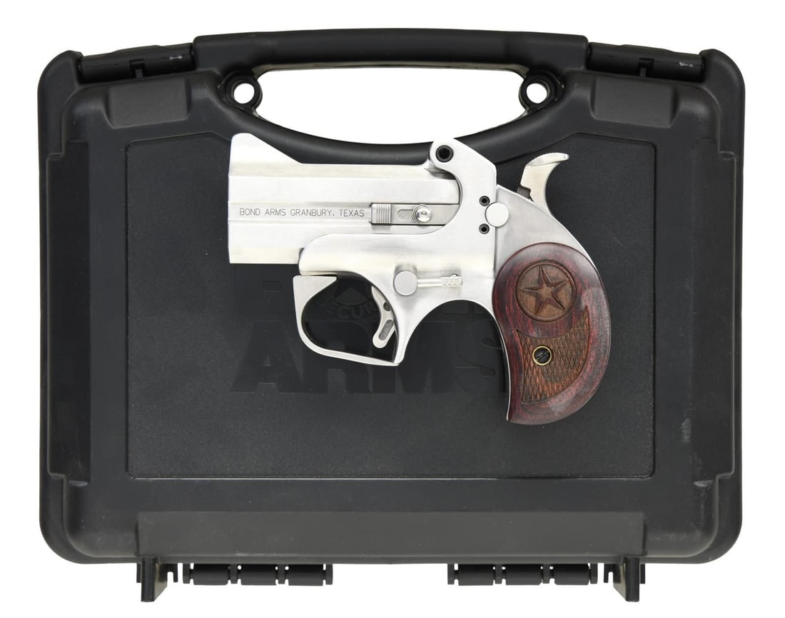 BOND ARMS TEXAS DEFENDER DERRINGER PISTOL.: Cal. 45 Colt & 410. S# 340027. Bbls. 3". Blade front sight. Stainless finish. Checkered hardwood grips w/ Texas star logo. UNATTACHED ACCESSORIES: factory hardcase matching numbered to gun w/ foam ins