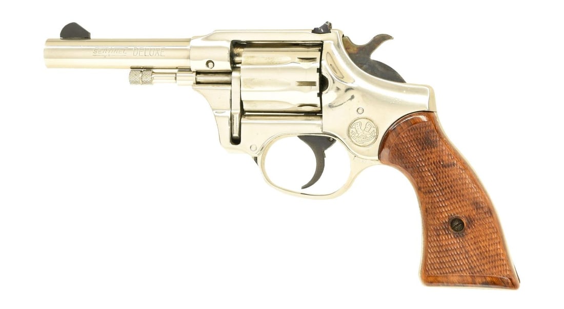 HI STANDARD SENTINEL DELUXE R-106 DA REVOLVER.: Cal. 22 LR. S# 1630281. Bbl. 4". Blade front sight. Square notch rear sight. 9-shot cyl. Mfg. 1965-67. Nickel finish. Checkered plastic grips. CONDITION: grips show light handling wear. Metal retains 